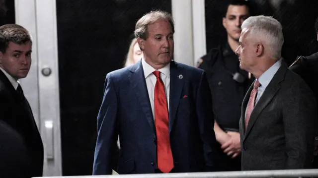 Ken Paxton entering the courtroom