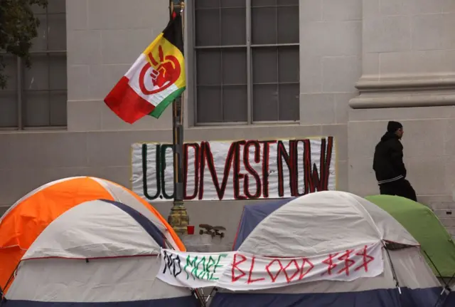 Signs up at an encampment on the University of California, Berkley campus