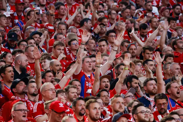 Bayern fans chant in the stands ahead of kick off