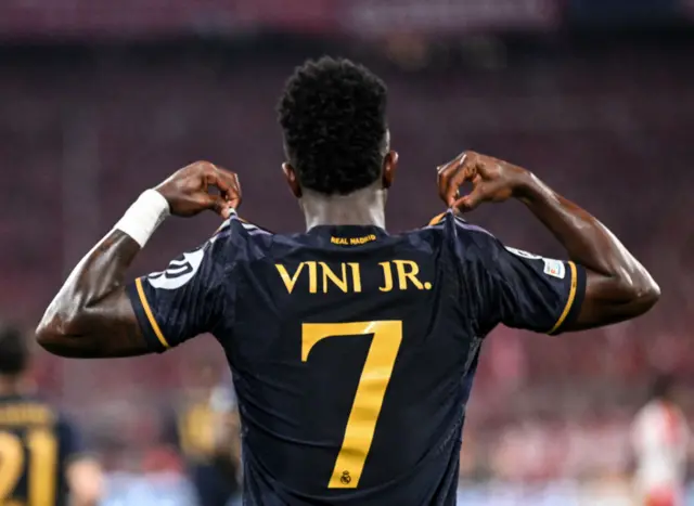 Vinicius celebrates his second goal by showing the name on the back of his shirt