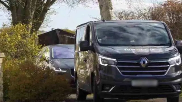 Car and a van leaving a property