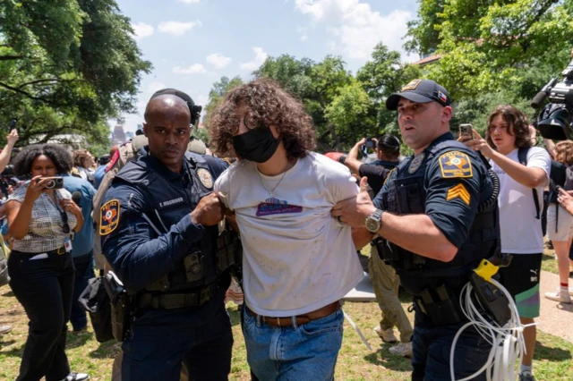 Texas University policemen arrest a Pro-Palestinian demonstrator at the University of Texas in Austin on 28 April 2024