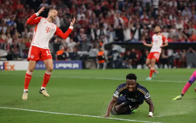 Vinicius grins after scoring the opener, Dier throws his hands up in anger