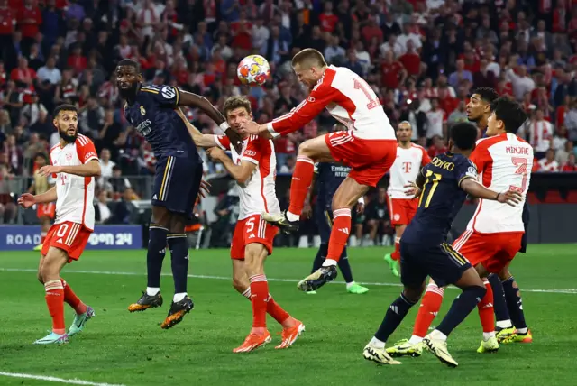 Dier rises highest to win the header in a packed box