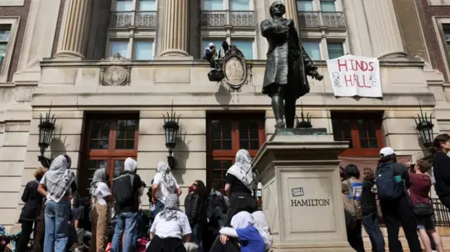 Student protesters move supplies from outside Hamilton Hall, where students at Columbia University have barricaded themselves inside as they continue to protest in support of Palestinians, despite orders from university officials to disband, or face suspension, during the ongoing conflict between Israel and the Palestinian Islamist group Hamas, in New York City, U.S., April 30, 2024