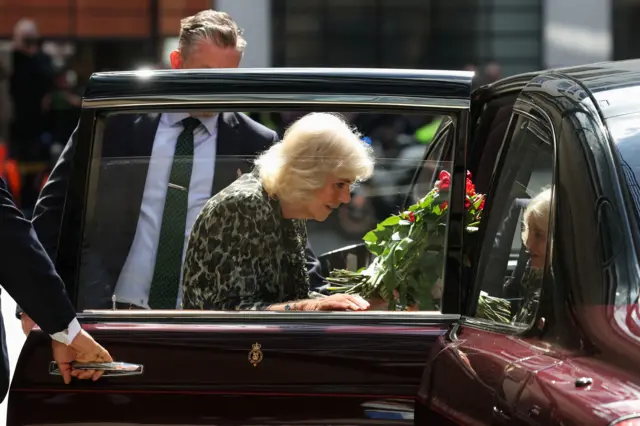 A photo of Queen Camilla getting back into her car