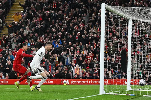 Darwin Nunez watches as the ball goes into the back of the net
