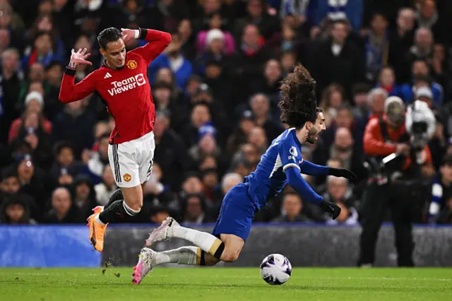 Antony brings down Marc Cucurella in the box