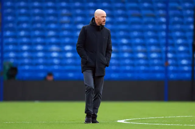 Manchester United manager Erik ten Hag walks on the pitch