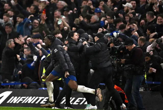 Chelsea fans, staff and players celebrate beating Manchester United 4-3