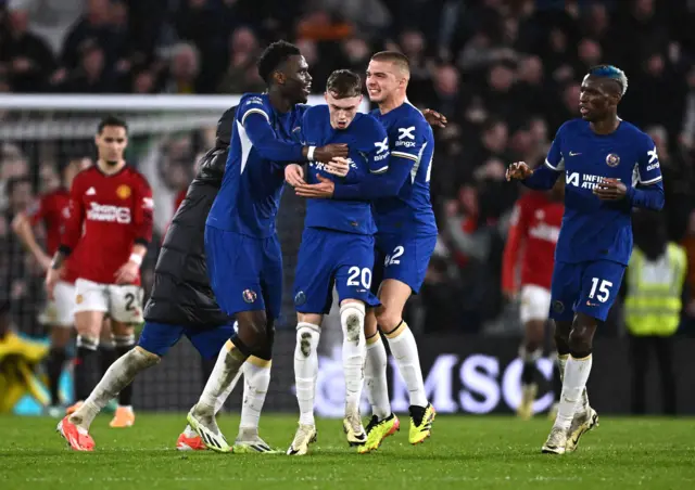 Chelsea players celebrate after Cole Palmer's winning goal against Manchester United