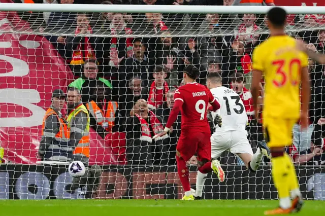 Ivo Grbic's attempted clearance is charged down by Darwin Nunez for a Liverpool goal