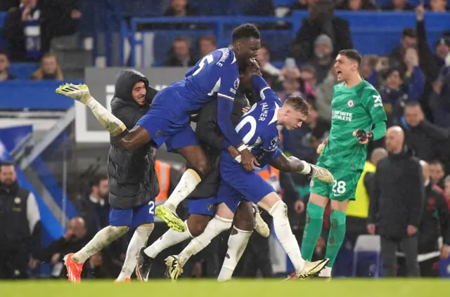 Chelsea players celebrate a Cole Palmer goal against Manchester United