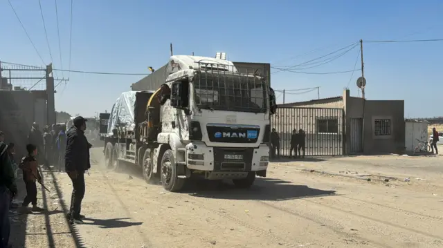 A truck carrying aid enters Gaza via the Kerem Shalom crossing