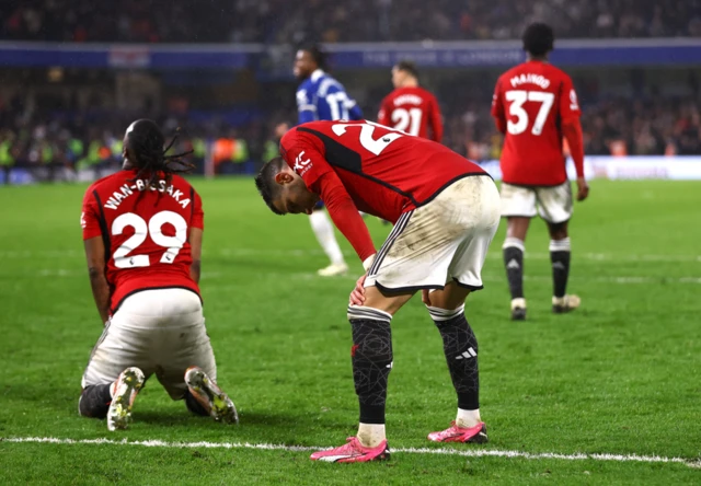 Manchester United players looking dejected against Chelsea