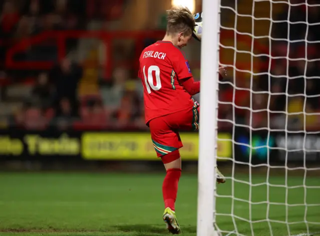 Jess Fishlock heads into the net