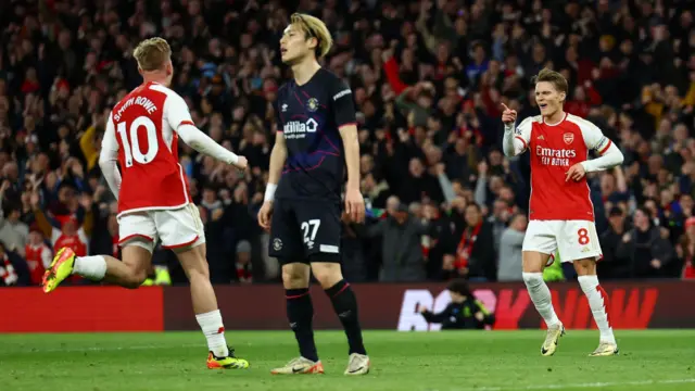 Martin Odegaard salutes Emile Smith Rowe after scoring against Luton