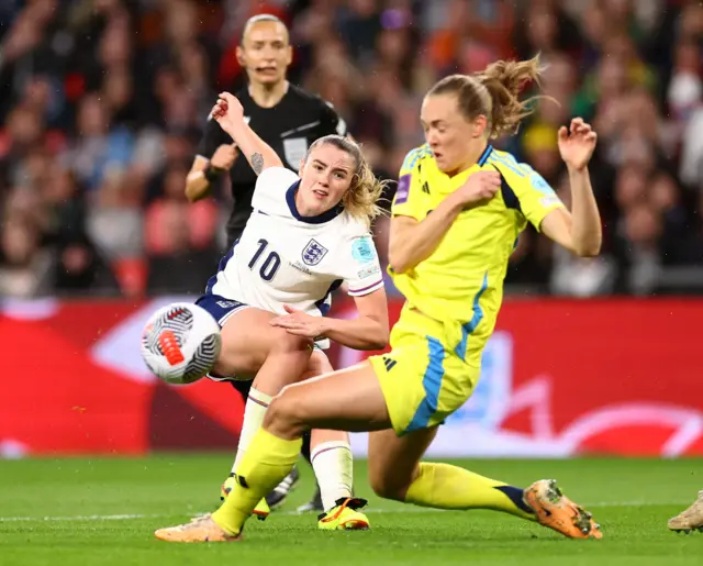 England's Grace Clinton has a shot blocked