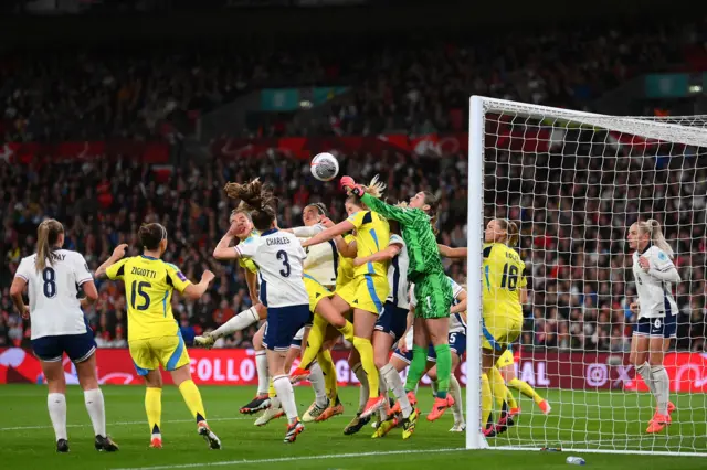 England's Mary Earps punches away a Sweden corner