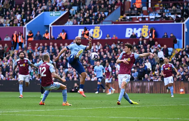 Bryan Mbeumo volleys the ball past Emi Martinez.