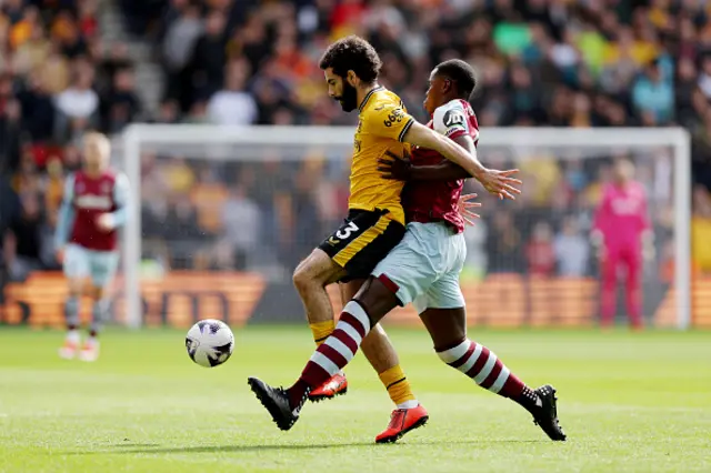 Rayan Ait-Nouri of Wolverhampton Wanderers is challenged by Kurt Zouma