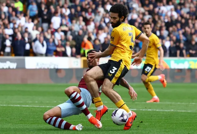 Emerson Palmieri fouls Wolverhampton Wanderers' Rayan Ait-Nouri to concede a penalty kick