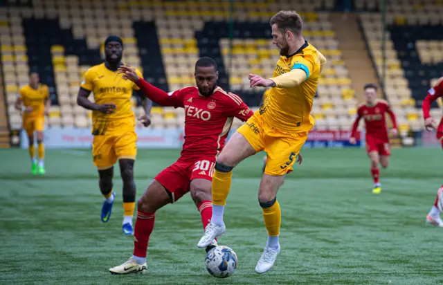 Aberdeen's Junior Hoilett and Livingston's Michael Devlin