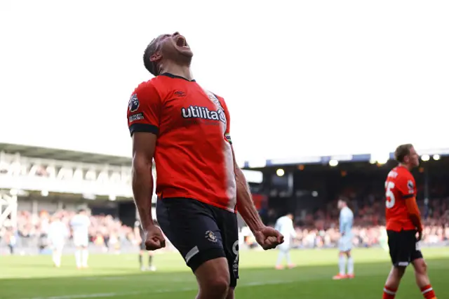 Carlton Morris celebrates scoring the match winner