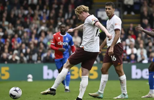 Kevin de Bruyne shoots at goal