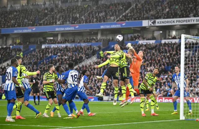 Verbruggen punches clear above a crowded penalty area