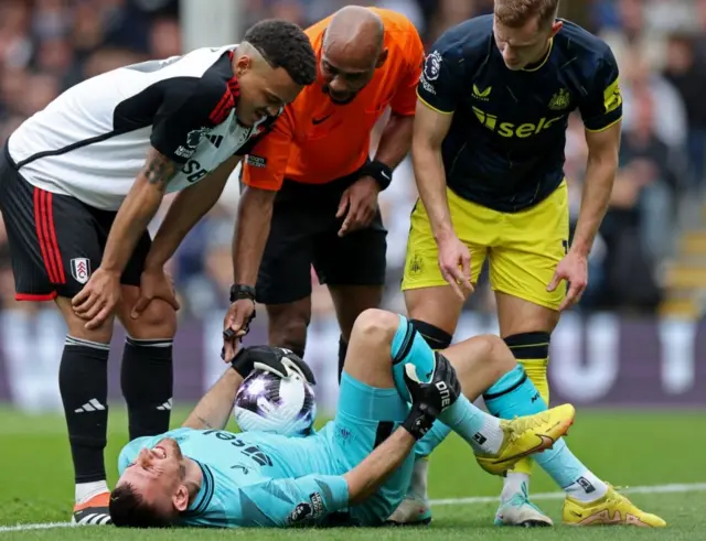 Martin Dubravka lays on the floor injured