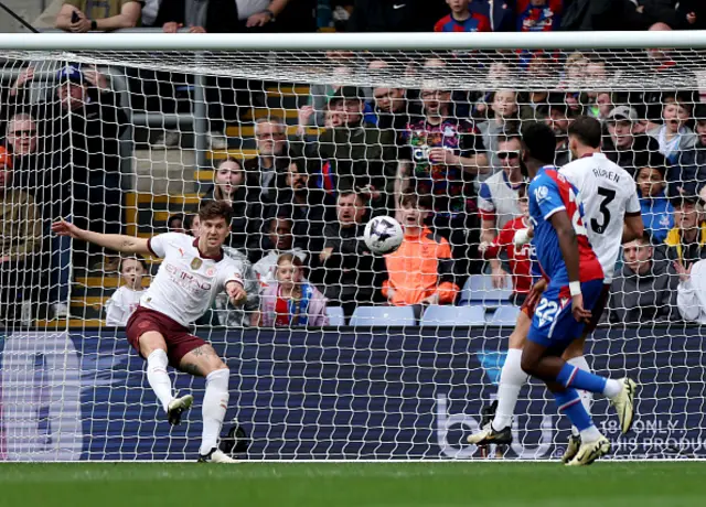 John Stones clears the ball away