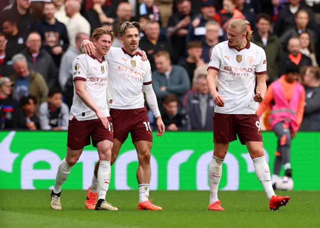 Kevin de Bruyne alongside Jack Grealish and Erling Haaland