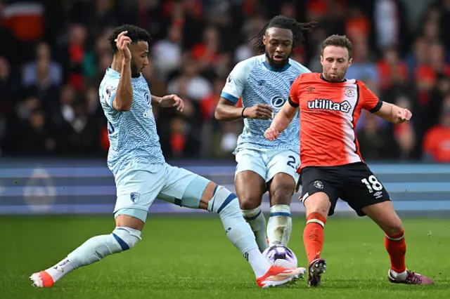 Jordan Clark (R) vies with Bournemouth's English defender #05 Lloyd Kelly