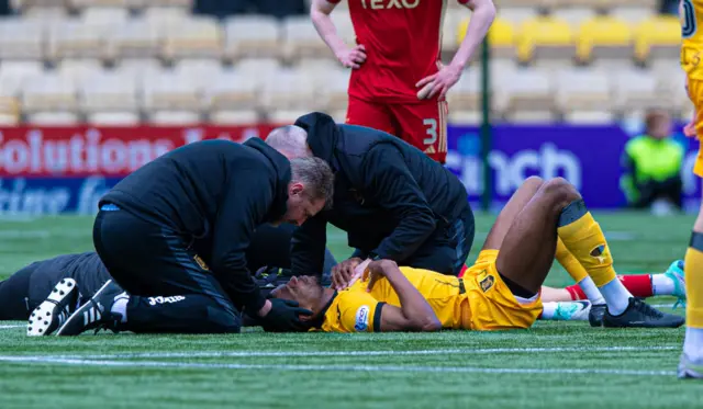 Livingston's Michael Nottingham receives treatment on an injury