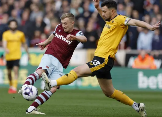 West Ham United's James Ward-Prowse in action with Wolverhampton Wanderers' Max Kilman