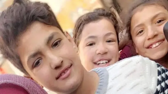 Alma (R) with her sister Reehab (C) and brother Ghanem (L), before they were killed in a reported Israeli air strike in Gaza City in December 2023