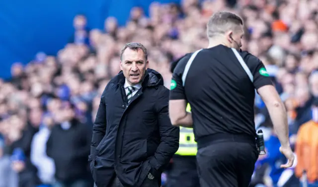 Brendan Rodgers looks on as John Beaton checks the monitor