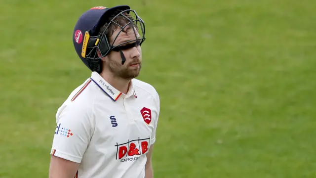 Matt Critchley walks off the field