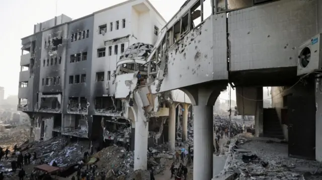 Palestinians inspect the damages at Al Shifa Hospital after Israeli forces withdrew from the Hospital and the area around it following a two-week operation, amid the ongoing conflict between Israel and Hama