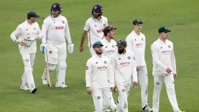 Notts and Essex players leave the field