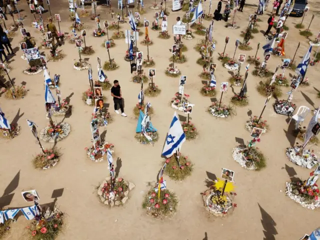 Family members visit the memorial site for victims killed during the Nova music festival in the October 07 Hamas attacks, near the border with Gaza Strip,southern Israel , 07 April 2024.