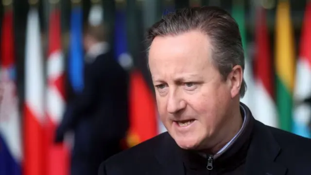 Foreign Secretary David Cameron speaks to the media during a North Atlantic Treaty Organization (NATO) Foreign Affairs Ministers meeting in Brussels