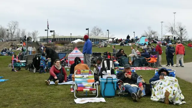 People are set up at Niagara Falls State Park ahead of a total solar eclipse across North America, in Niagara Falls, New York, on April 8, 2024.