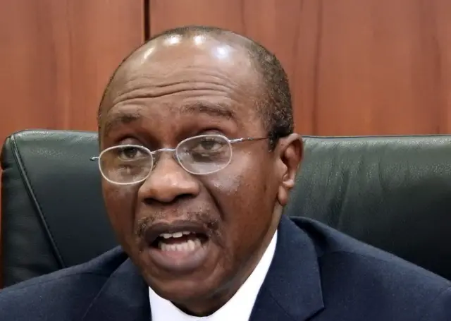 Central Bank of Nigeria's (CBN) governor Godwin Emefiele gives a press conference on the naira devaluation during a media briefing in Abuja on June 15, 2016.