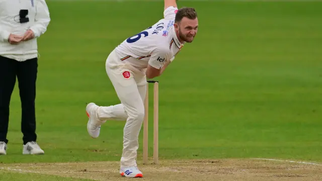 Sam Cook bowling for Essex