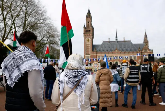 Demonstrators gathered outside the International Court of Justice in The Hague on Monday. Some are holding Palestinian flags