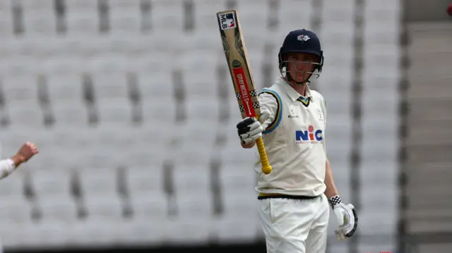 Harry Brook raises his bat