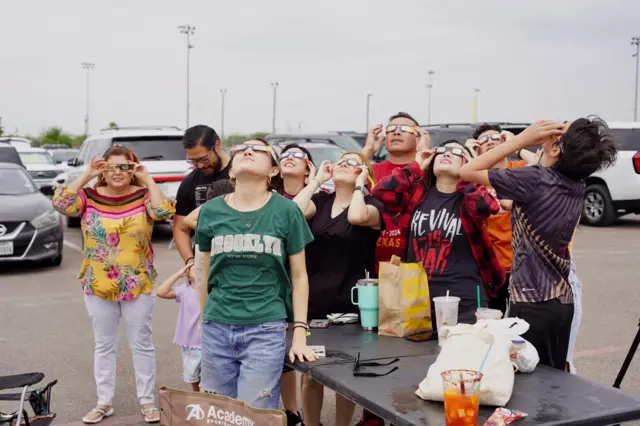 People stare at the sky in Texas