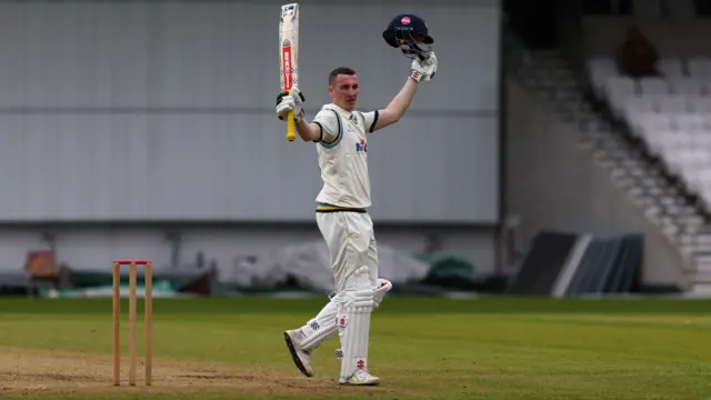 Harry Brook raises his bat